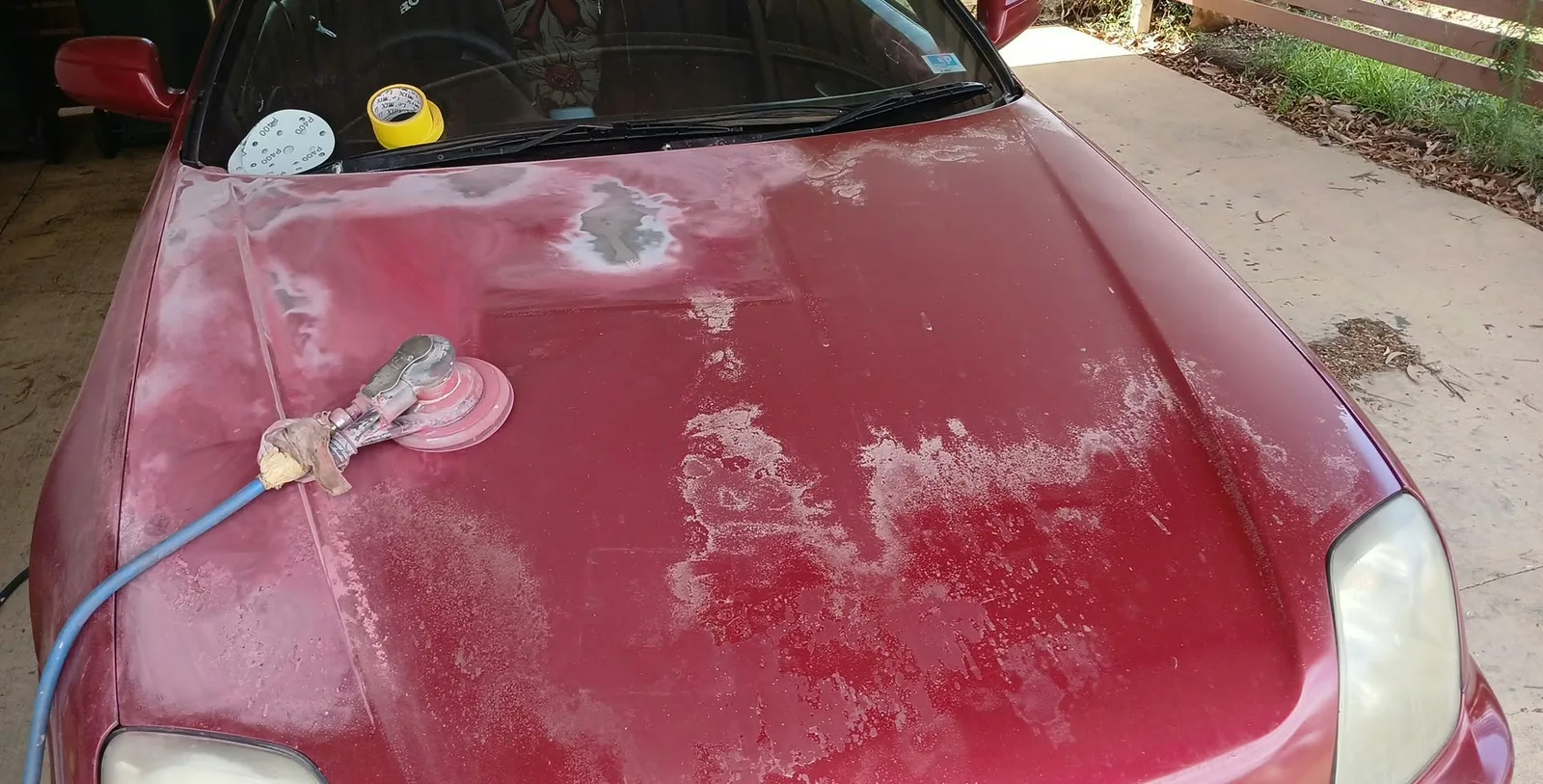 Red Honda with faded damaged paint before refinishing